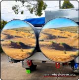 Two camper spare tyre covers with outback desert photos on them