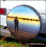 Photo of caravan spare tyre cover showing a fisherman at sunset