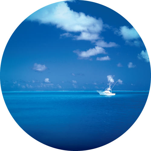 Peaceful photo of beautiful blue ocean with boat. Quality spare tyre covers.